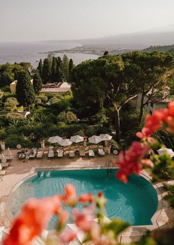 Aerial view of the outdoor swimming pool at Belmond Grand Hotel Timeo