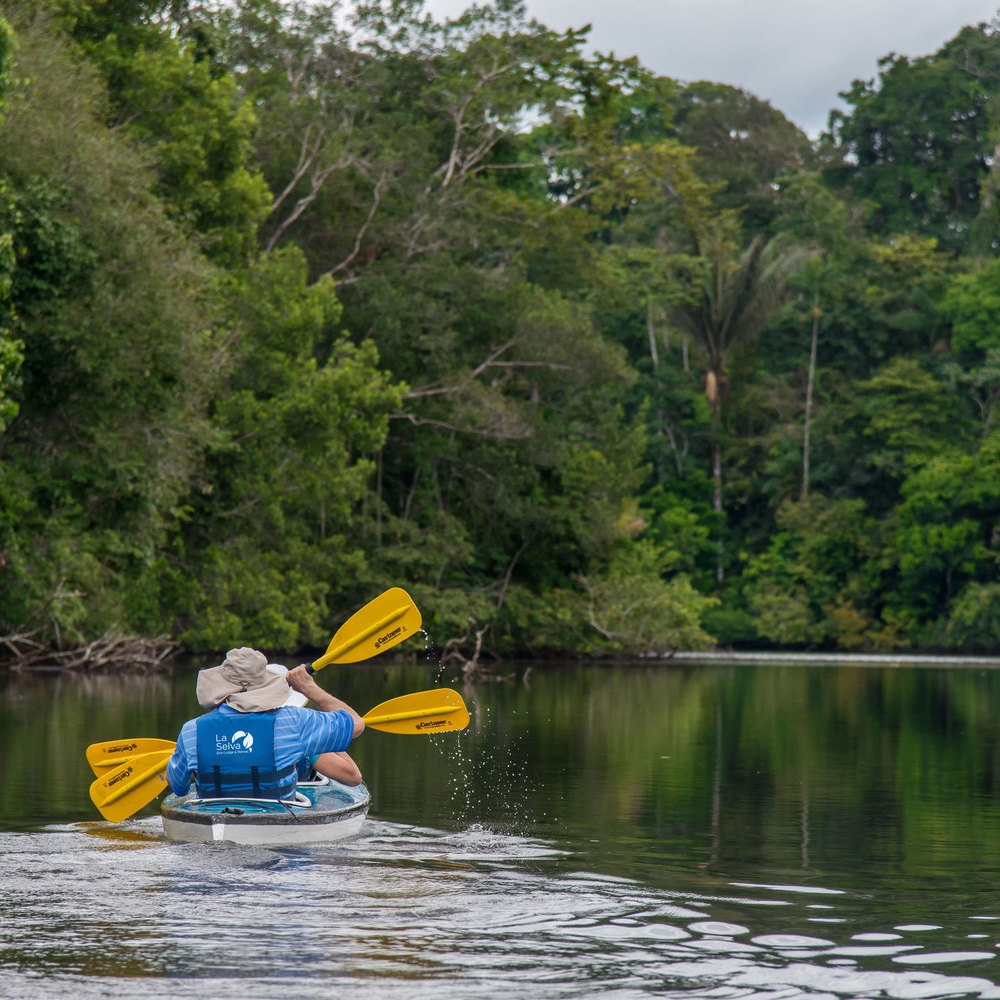 Two people kayaking on a lagoon.