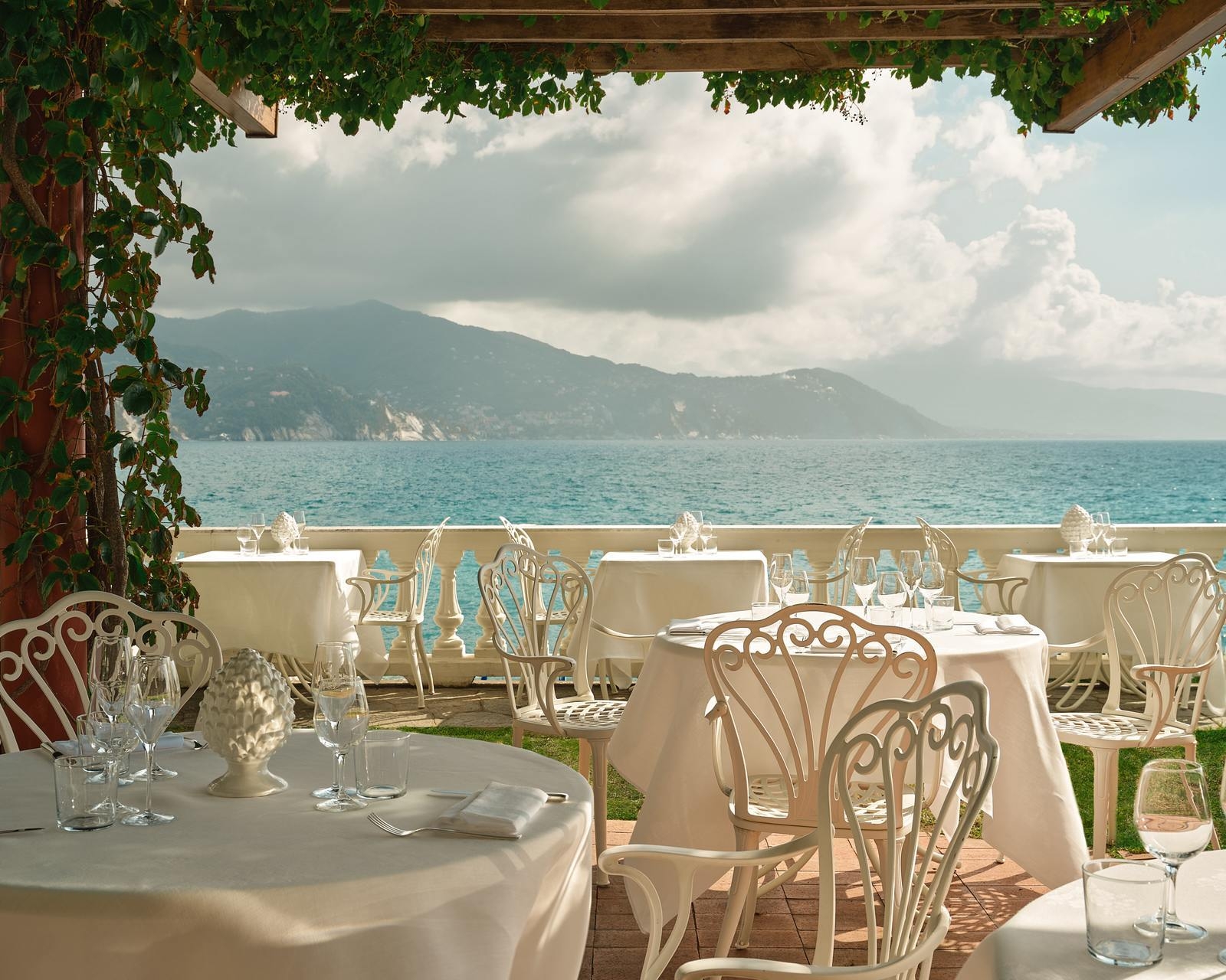 Al fresco restaurant terrace facing the sea at Grand Hotel Miramare