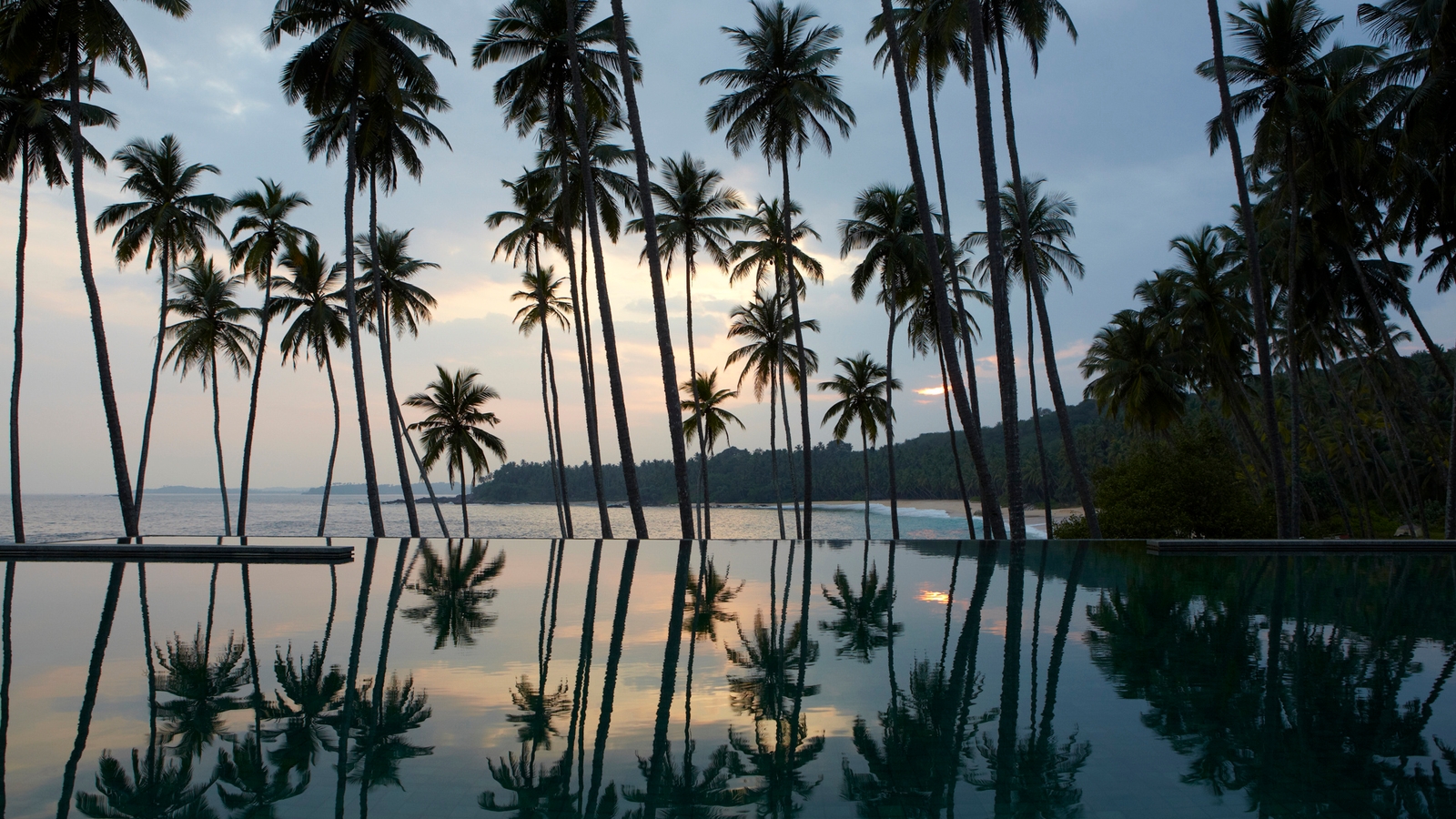 amanwella-pool-and-trees-sunset