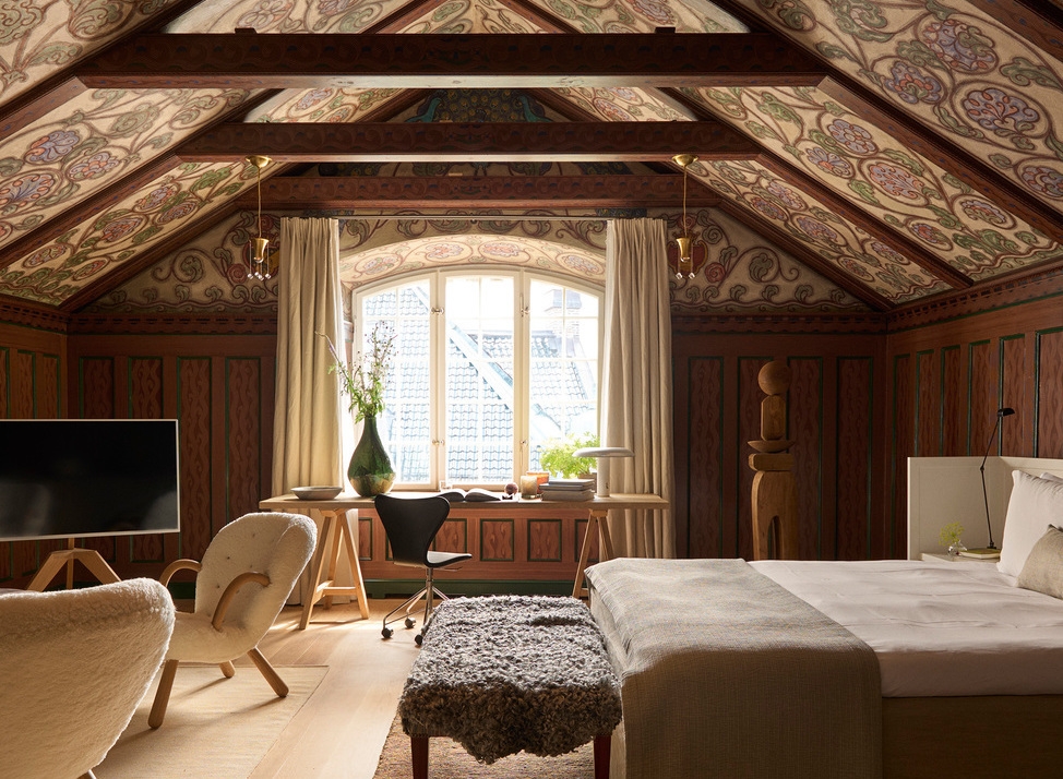 The attic suite at Ett Hem with an ornate vaulted ceiling.