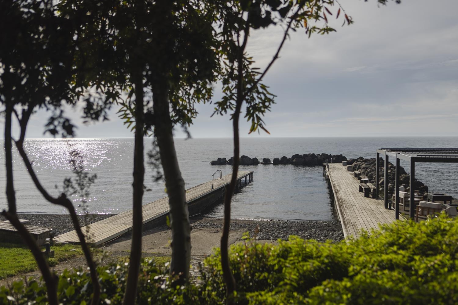 Hotel AWA's lakeside area featuring a pier.