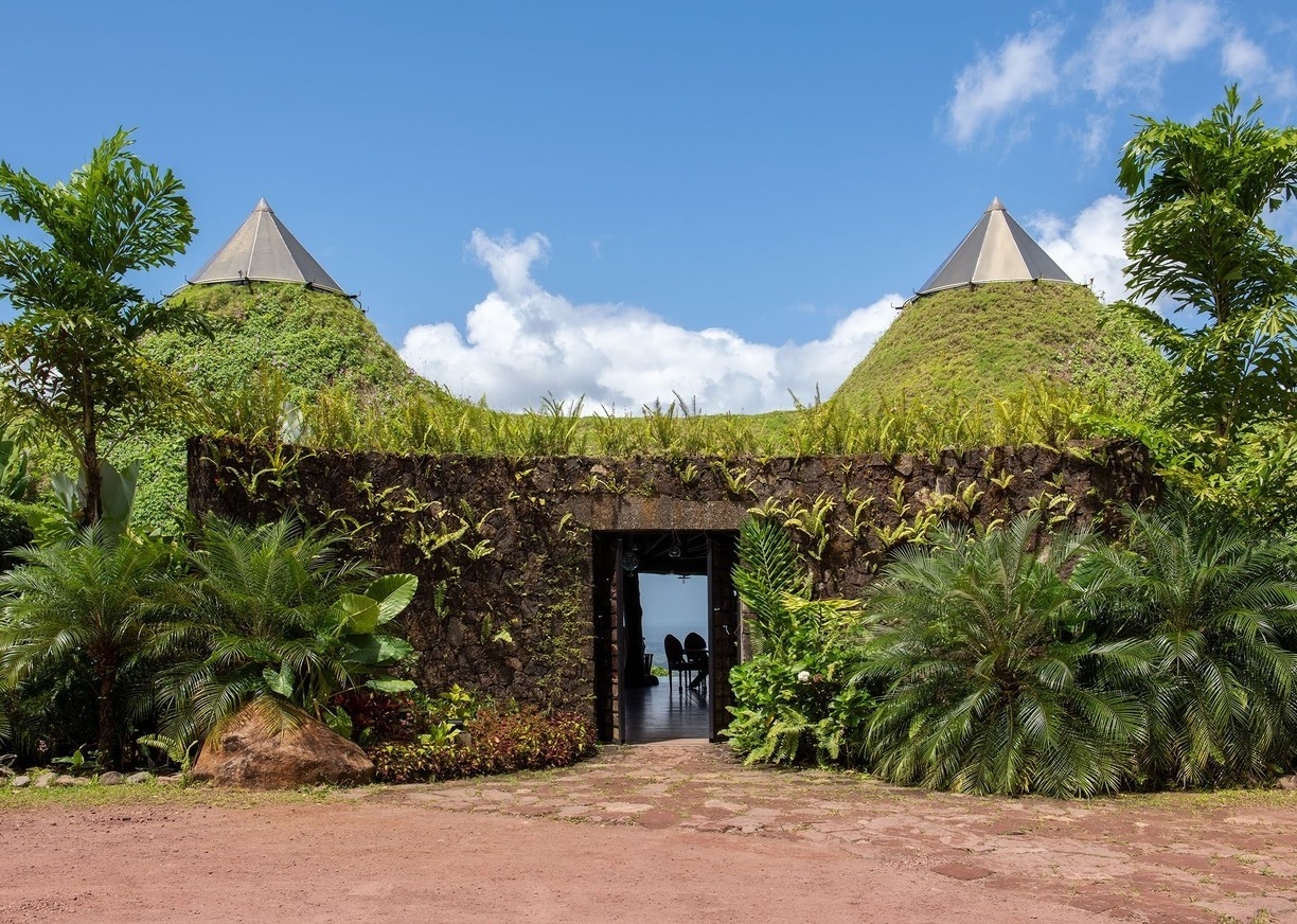 Restaurant exterior covered in foliage at Origins Lodge, Costa Rica