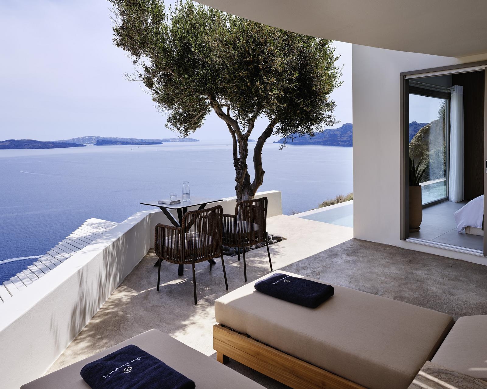 Private terrace with sun loungers at Andronis Luxury Suites