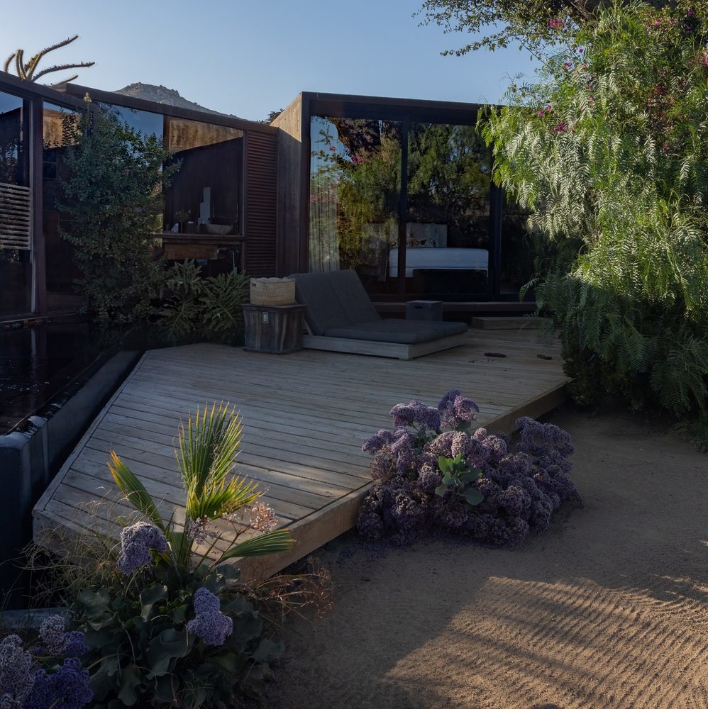 A shaded private terrace outside one of the rooms at Casa Ocho, Valle de Guadalupe