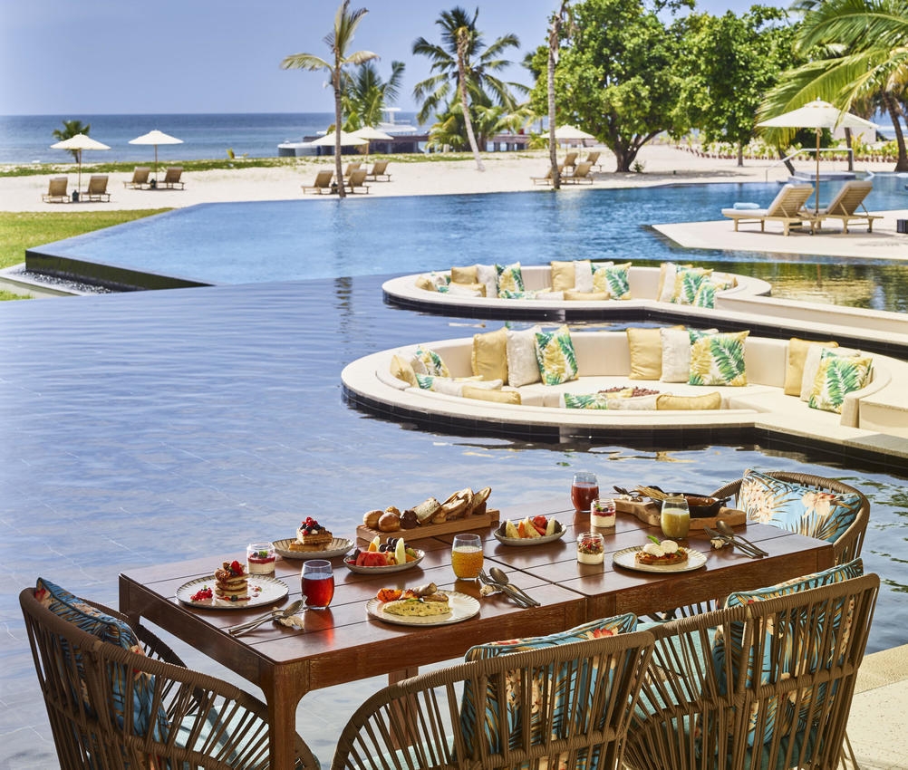 Breakfast poolside at Waldorf Astoria Seychelles Platte Island.