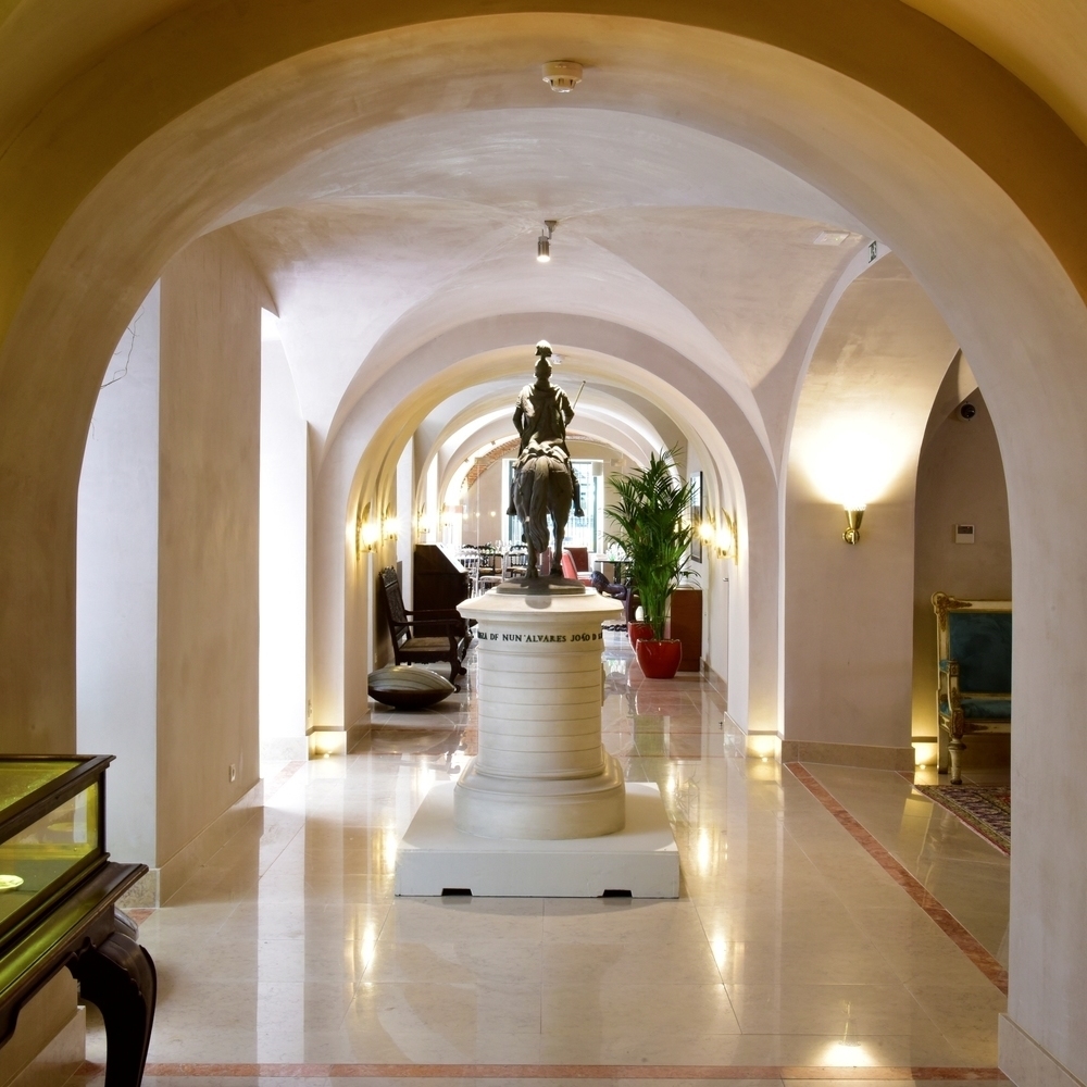 A statue of a man on a horse in the lobby of Pousada de Lisboa in Lisbon