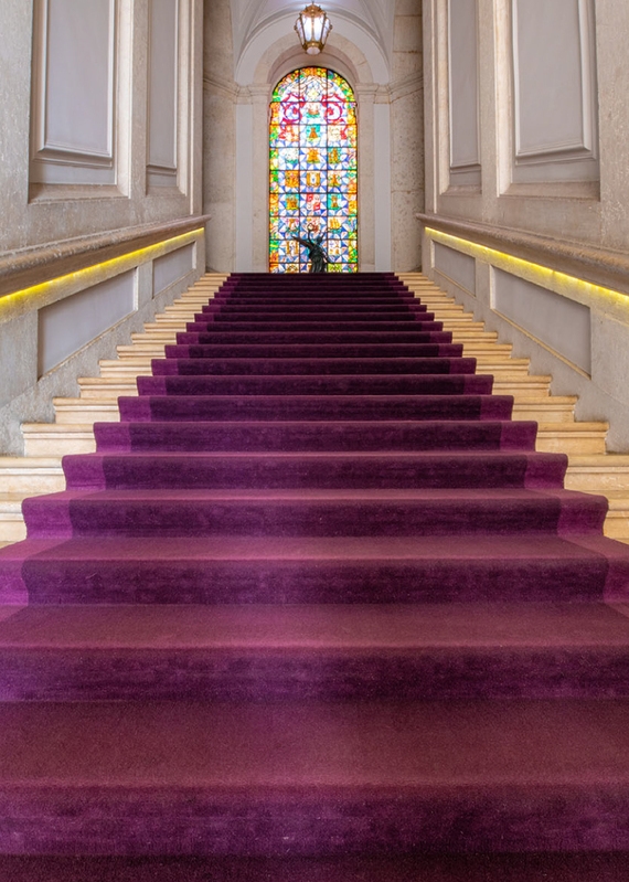 Staircase with stained glass window at Pousada de Lisboa in Lisbon