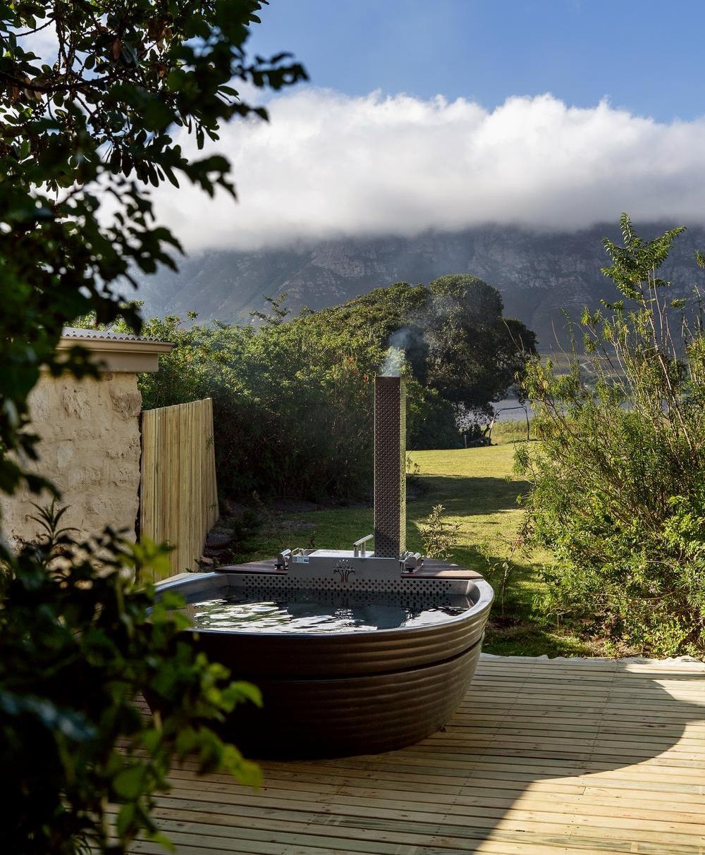 An outdoor wood-fired hot tub at Coot Club.