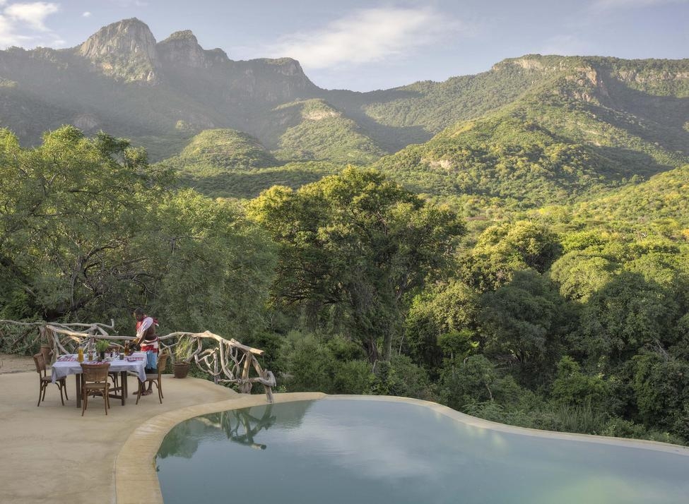 The pool area at Sarara Treehouses overlooking the surrounding mountains.