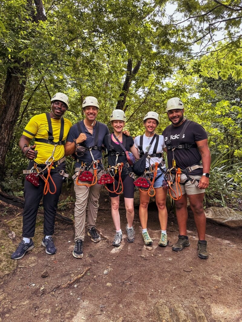 people with helmets and harnesses on