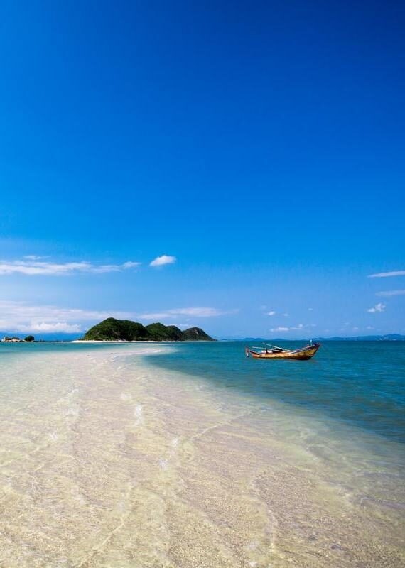 A boat floating by the beach at Nha Trang, Vietnam