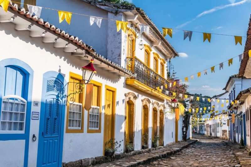 Colourful houses with banners in the historic centre of Paraty, Brazil