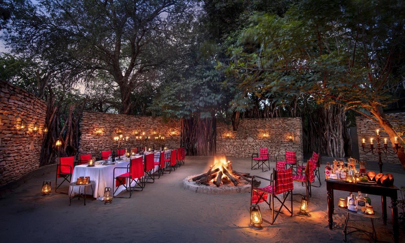 Boma dining at Chitwa Chitwa featuring a bonfire.