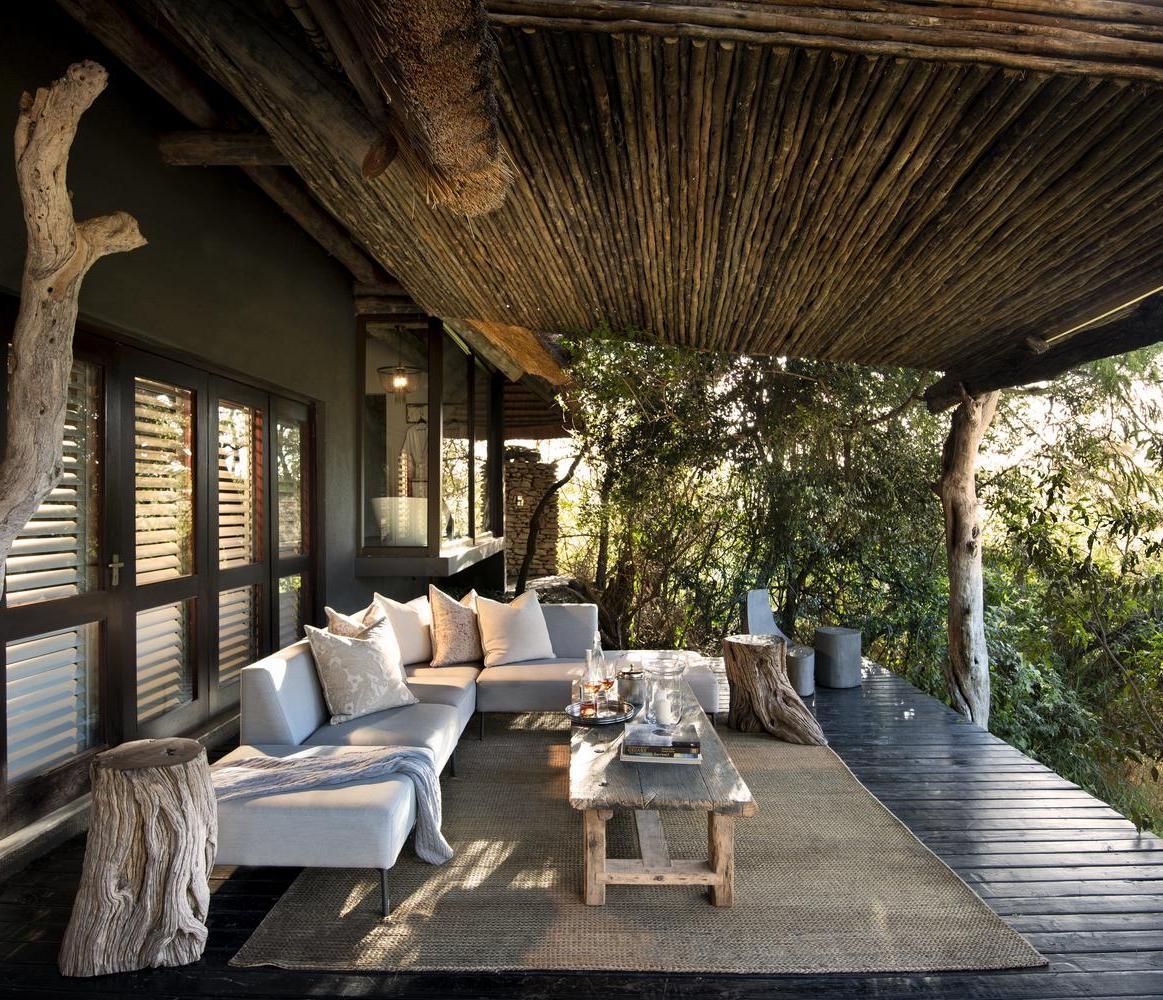 The terrace area of one of Chitwa Chitwa's accommodations featuring an L-shaped sofa.