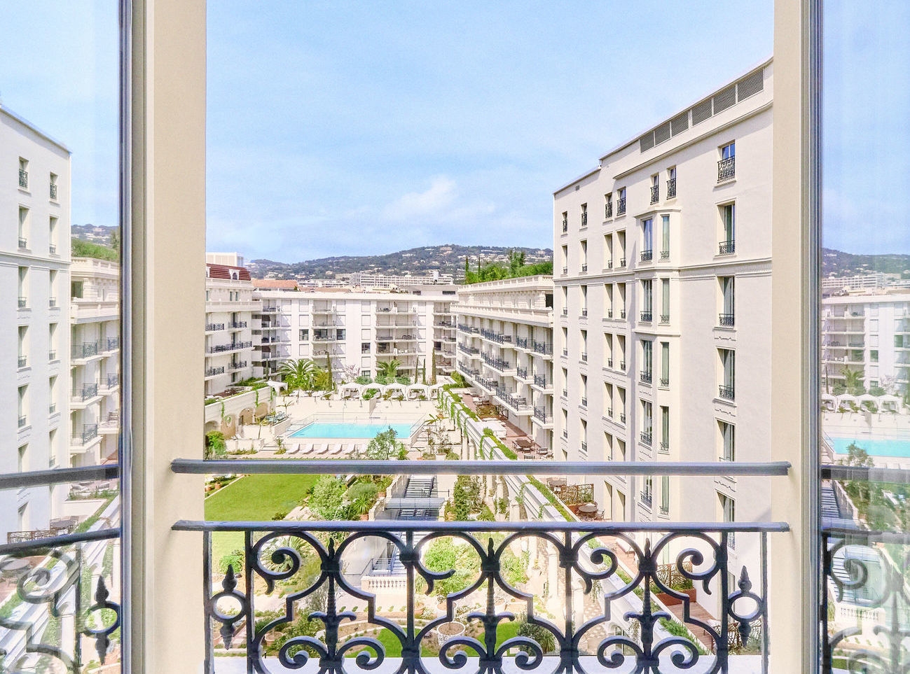 A view of the pool area in the inner courtyard at Carlton Cannes.