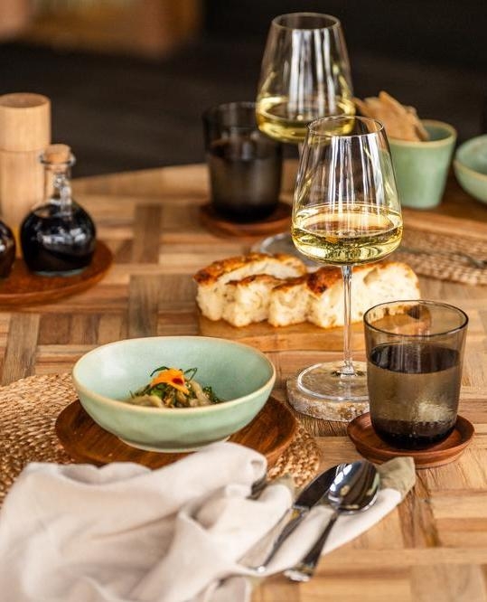 Wilderness Magashi Peninsula lunch bowls and wine on a wooden table