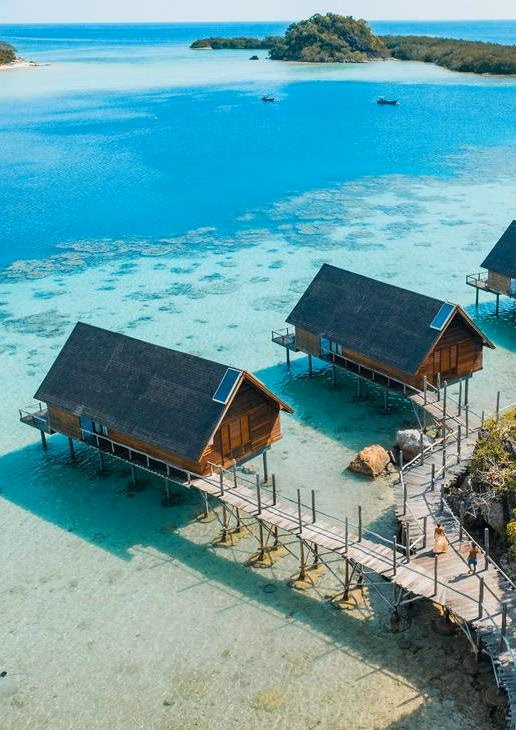 Aerial view of overwater bungalows at Bawah Reserve in Indonesia