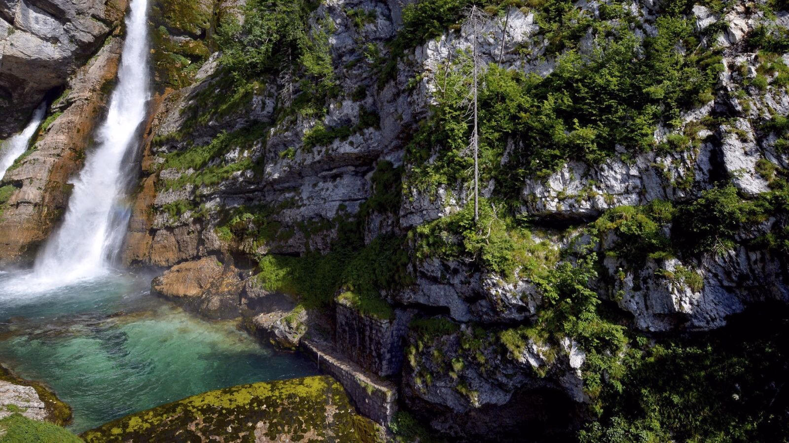 Waterfall down a sheer rock face in the alps of Lake Bohinj in Slovenia