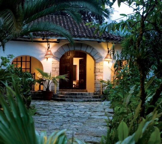 Entrance to the lobby of Inkaterra Machu Picchu Pueblo Hotel, Peru, at twilight