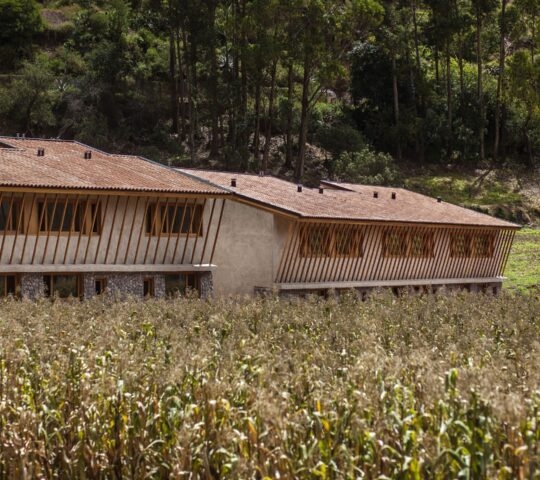 External view of Valle Sagrado Hotel set among crops ready for harvest, Sacred Valley, Peru