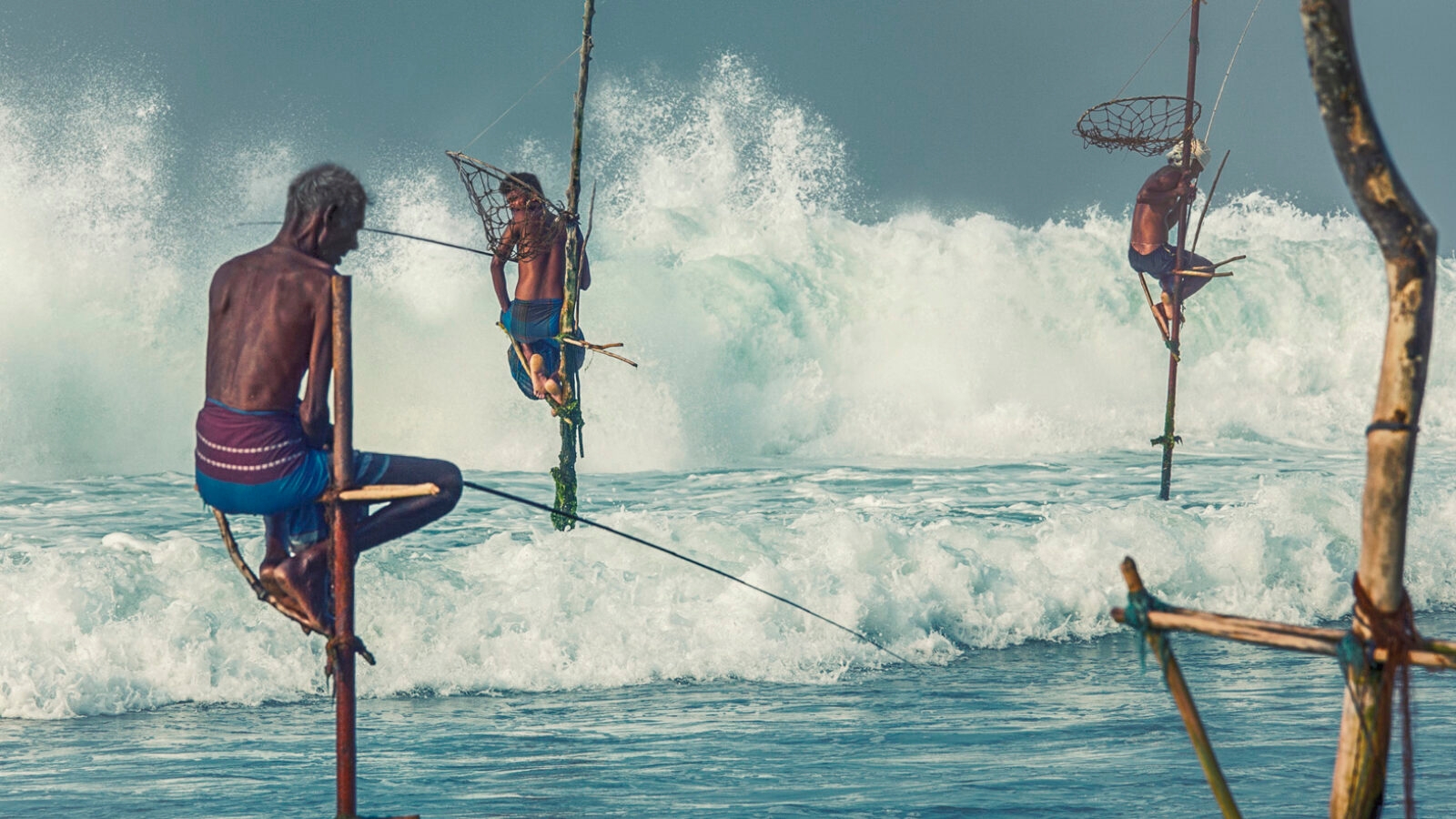 Traditional stilt fisherman in the sea, Sri Lanka