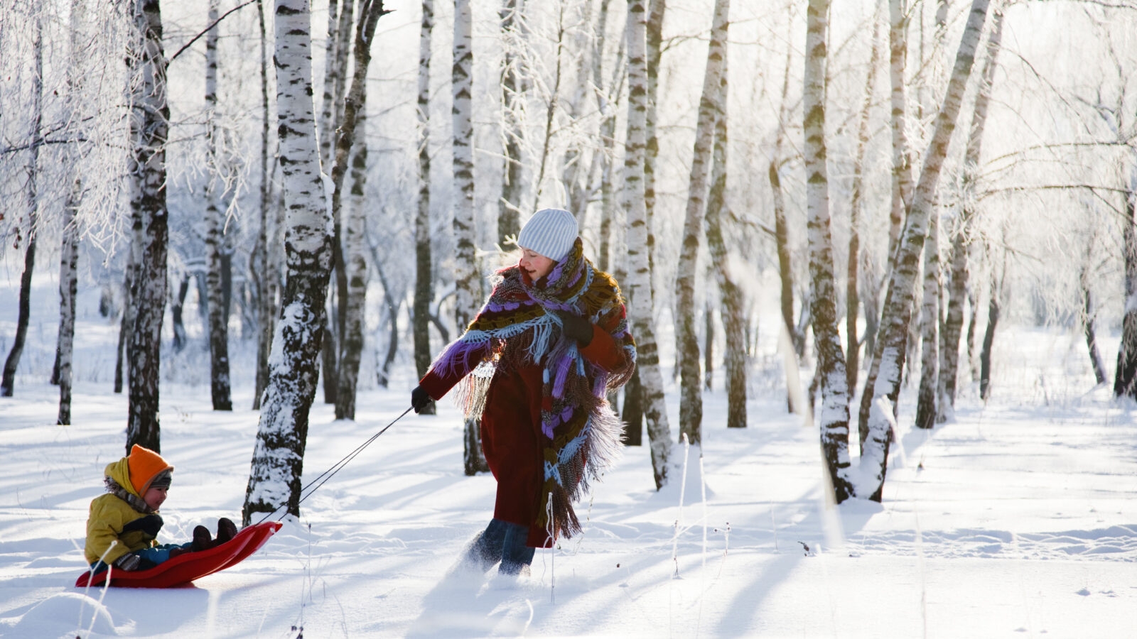 Family having fun in winter in Norway