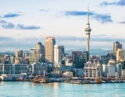 An early morning view of the CBD of Auckland, across the water of Waitemata Harbor.