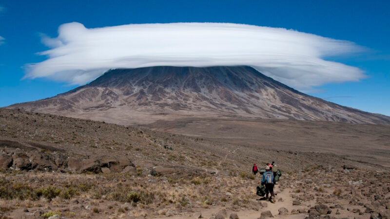 A group of porters passing through The saddle area on Rongai Route, Kilimanjaro