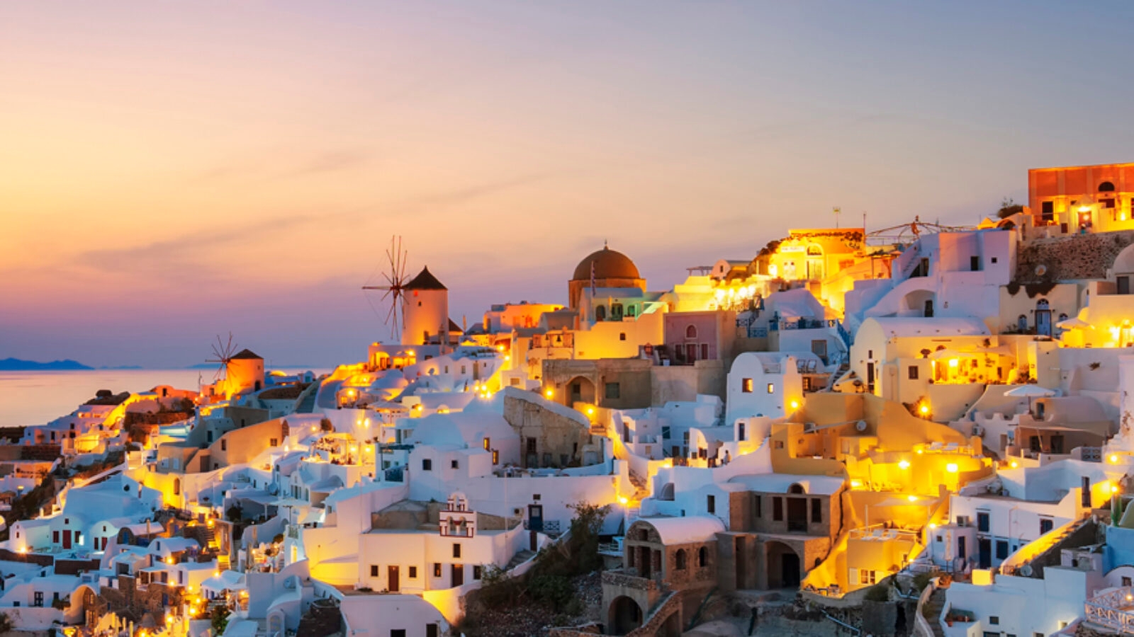 Luxury Grand Tours of Europe - Panoramic view of Oia at sunset