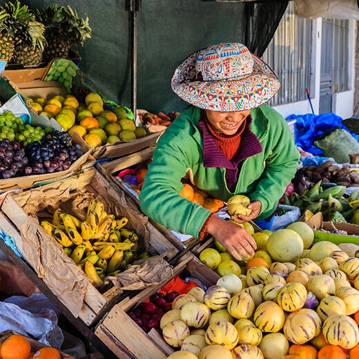 Luxury Peru Tours - Peruvian woman selling fruits, Chivay