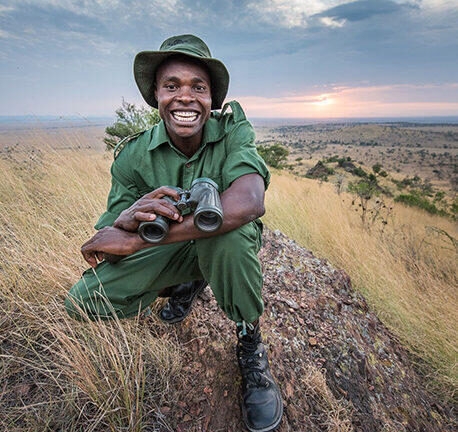 Guide smiling at the camera in safari gear on a luxury Africa safari
