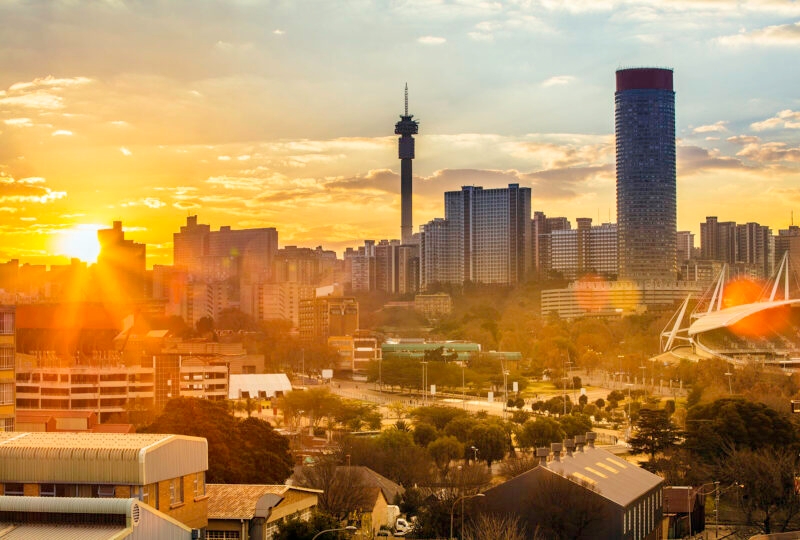 Johannesburg cityscape, taken at sunset, showing Hillbrow residential centre with the prominent Ponte flats and the communications tower on a luxury Africa vacation