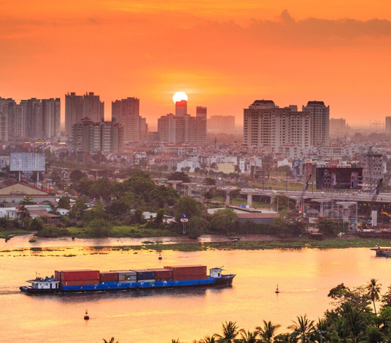 Luxury Vietnam Tours - The sun setting behind the city of Saigon