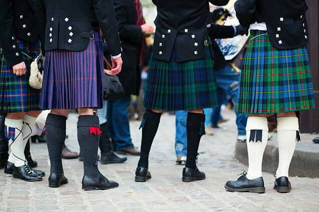 Arts, Culture & History trips - Waist down view of a group of men in traditional kilts