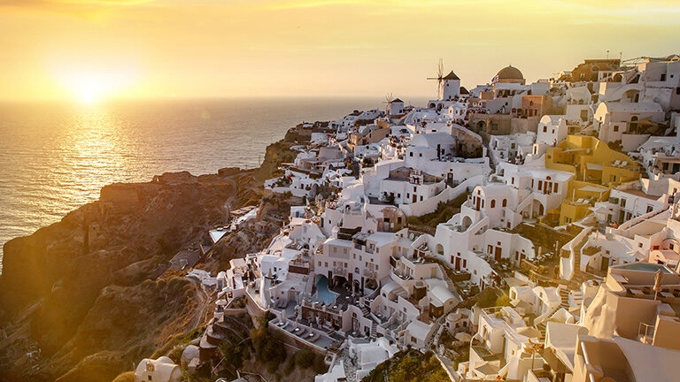 Impressive evening view of Santorini island. Picturesque sunset on the famous Greek resort Oia, Greece, Europe.