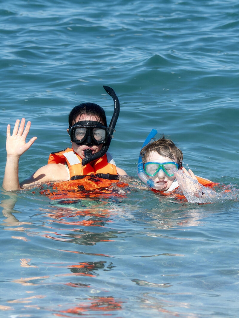 Snorkeling in the ocean as part of luxury Latin America family holidays.