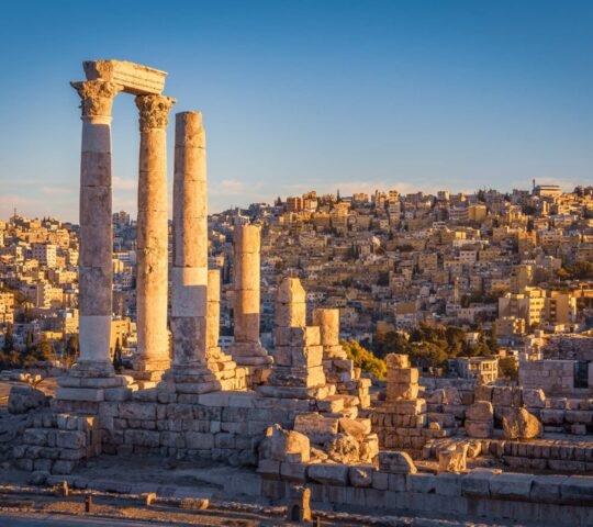 The column remains of the Temple of Hercules overlooking the sand-coloured city of Amman in Jordan