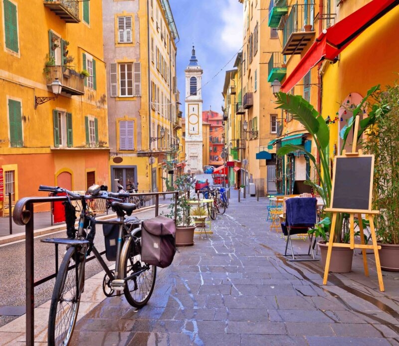 Nice colorful street architecture and church view, tourist destination of French riviera, Alpes Maritimes depatment of France
