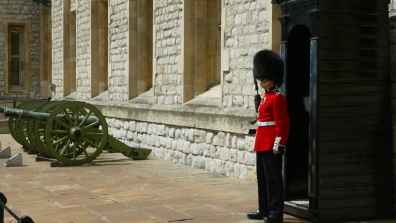 A beefeater stands guard in his traditional attire in London