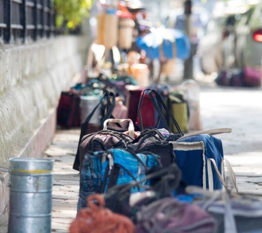 Colourful bags along a street sidewalk