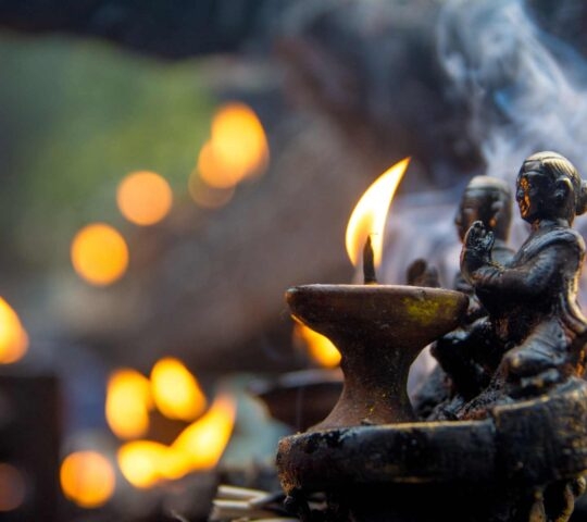A small ceremonial tea light burning