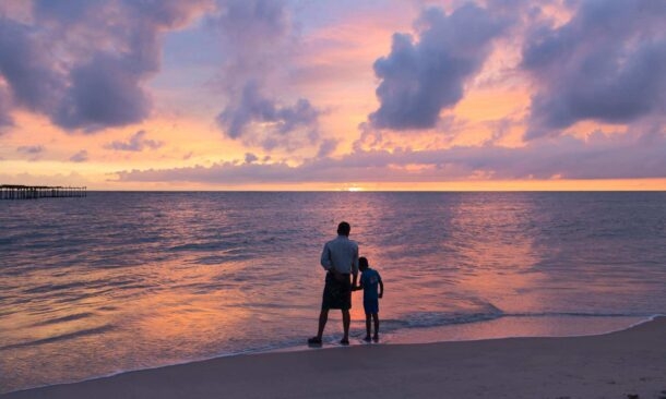 Father and son at Alleppey Alappuzha Beach Kerala India
