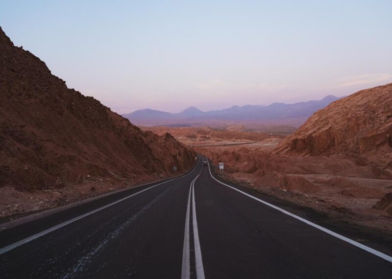 Landscape shot during sunset of road crossing mountains in Atacama desert, Chile