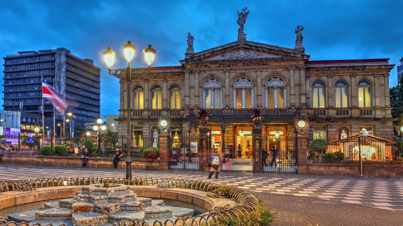 Night scene of the square in front of the National Theatre of Costa Rica in San Jose at twilight time.