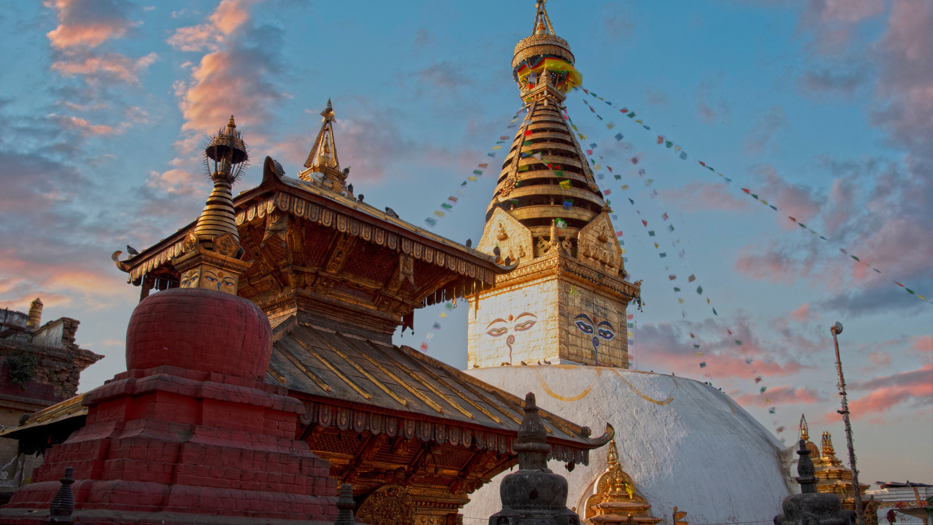 Swayambhunath Stupa at sunset with prayer flags, Kathmandu, Nepal.