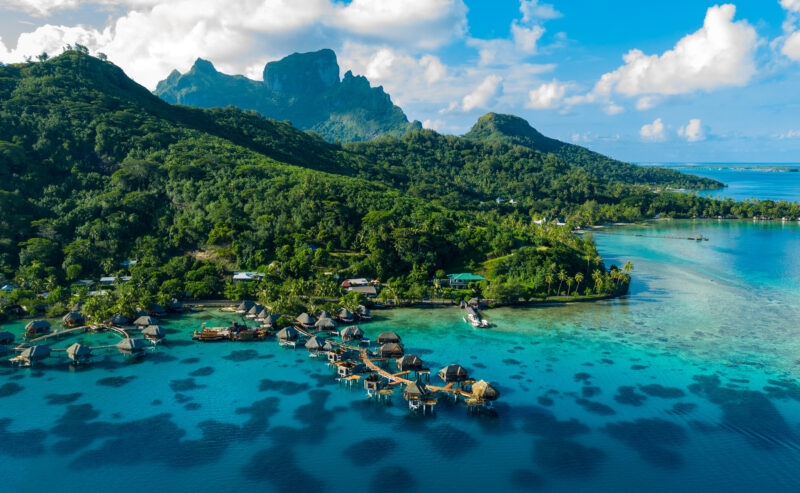 Bora Bora aerial drone image of travel vacation paradise and overwater bungalows