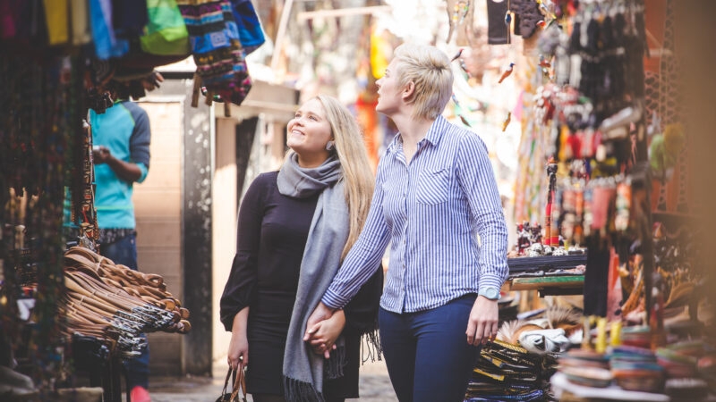 Close up image of a same sex female / lesbian couple enjoying sightseeing in the Cape Town South Africa city Center