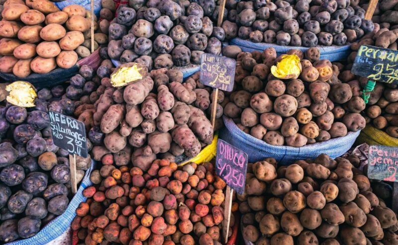 Luxury Peru Tours - different varieties of potatoes at a market in Peru