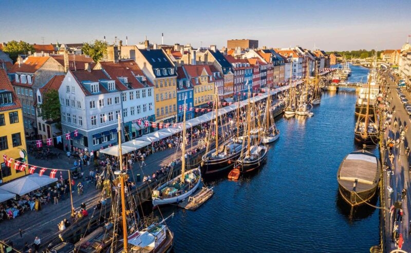 A canal with boats harboured in Copenhagen, Denmark